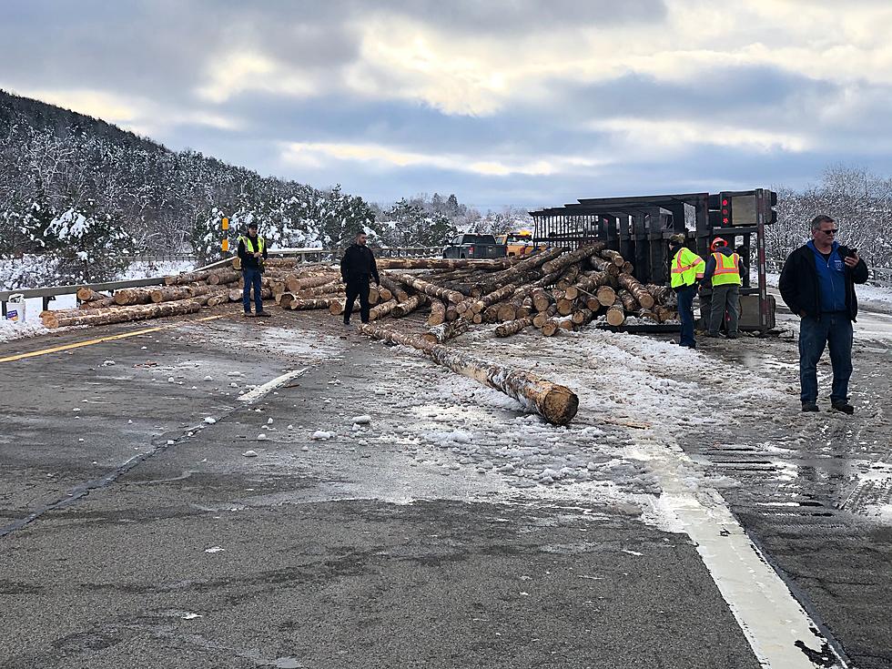 Driver Hurt, Interstate 86 Closed After Truck Hauling Logs Overturns