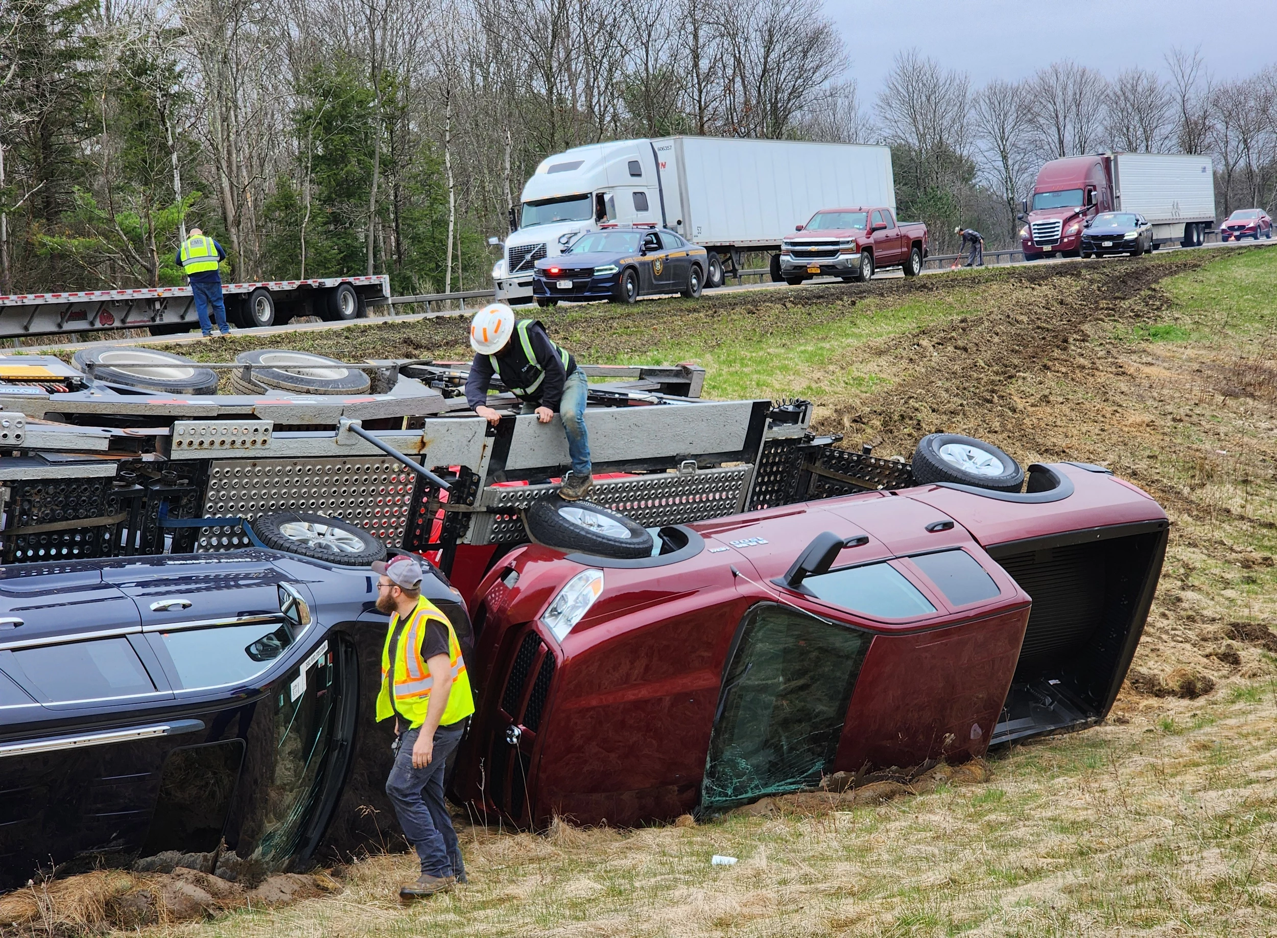 Workers from Als Garage examining vehicles that were damaged in a crash near Castle Creek. Photo: Bob Joseph/WNBF News