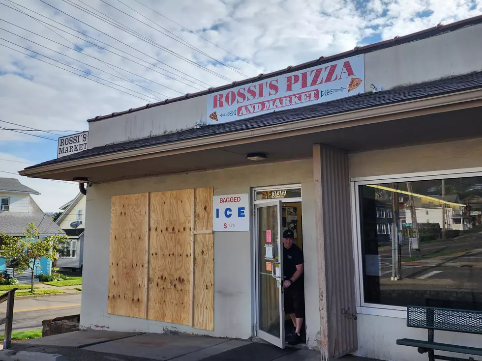 A section of Rossi's Pizza on Oak Hill Avenue was boarded up after a vehicle smashed through a window. (Photo: Bob Joseph/WNBF News)